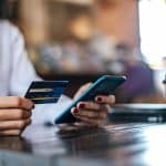 Pay for goods by credit card through a smartphone in a coffee sh