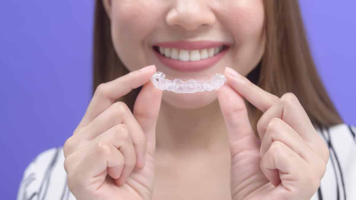women with Invisalign braces